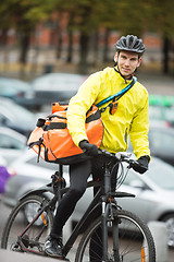 Image showing Male Cyclist With Courier Delivery Bag On Street