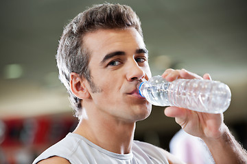 Image showing Man Drinking Water From Bottle At Health Club
