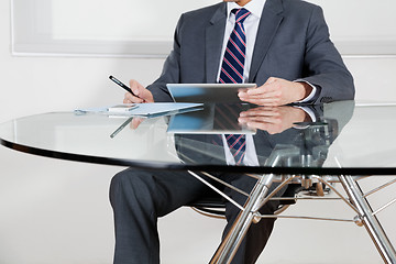 Image showing Businessman Using Digital Tablet In Office