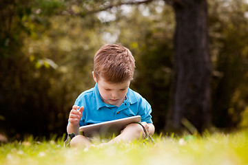 Image showing Young Boy with Digital Tablet