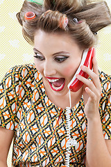 Image showing Woman Screaming While Holding Retro Phone