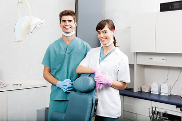 Image showing Two Dentists Smiling By Dental Chair At Clinic