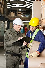 Image showing Supervisor Showing Clipboard To Foreman