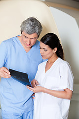 Image showing Technicians Looking At X-ray