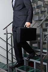 Image showing Low Section Of Businessman Descending Stairs