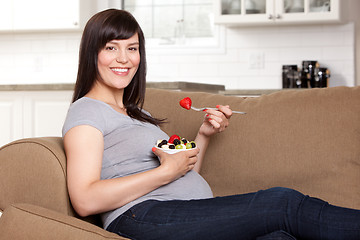 Image showing Pregnant Woman Eating Healthy Snack