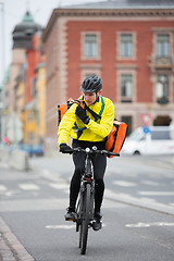 Image showing Cyclist With Courier Bag Using Walkie-Talkie