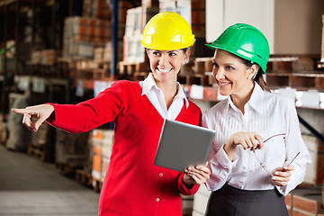 Image showing Female Supervisor With Colleague At Warehouse