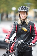 Image showing Young Female Cyclist With Courier Delivery Bag