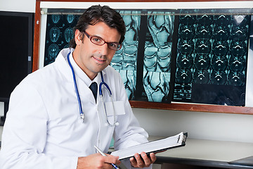 Image showing Radiologist At Desk With Clipboard