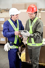 Image showing Foremen Using Digital Tablet in Warehouse