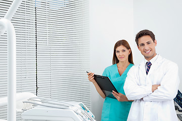Image showing Doctor And Female Assistant In Dental Clinic