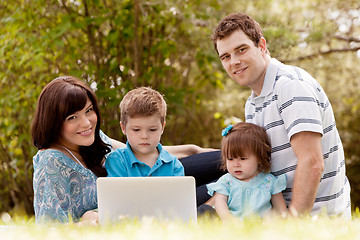 Image showing Outdoor Family with Computer
