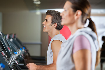 Image showing Man And Woman Running On Treadmill