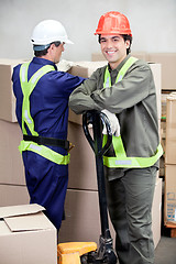 Image showing Foreman With Colleague Working At Warehouse