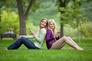 Image showing Women With Cellphones In Park