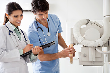 Image showing Radiologist And Technician Working Together