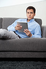 Image showing Man Holding Digital Tablet