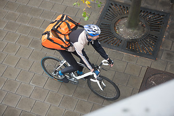 Image showing Male Cyclist With Backpack On Sidewalk