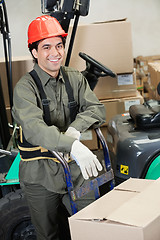 Image showing Foreman Leaning On Handtruck At Warehouse