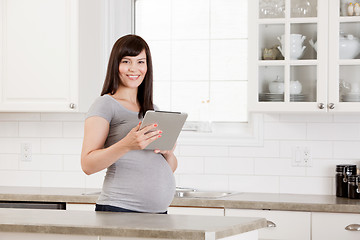 Image showing Pregnant Woman with Digital Tablet