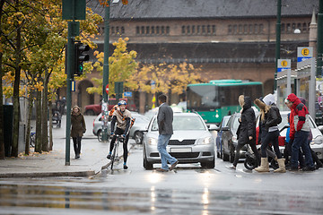 Image showing Vehicles Waiting For Commuters To Cross The Street