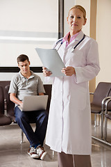 Image showing Female Doctor Holding File