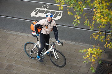 Image showing Young Male Cyclist With Backpack On Sidewalk