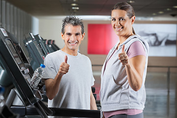 Image showing Instructor And Client Showing Thumbs Up Sign In Health Club