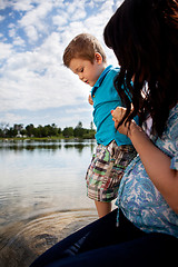 Image showing Mother Playing in Water with Son