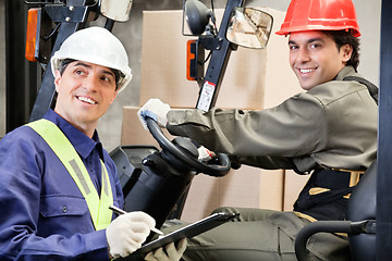 Image showing Portrait Of Forklift Driver With Supervisor Writing Notes