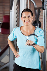 Image showing Woman Training On Machine In Gym