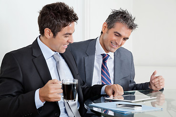 Image showing Businessmen Using Digital Tablet In Office