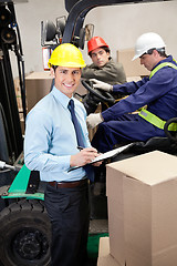 Image showing Supervisor With Foremen Working At Warehouse