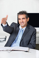 Image showing Businessman Offering Handshake In Office