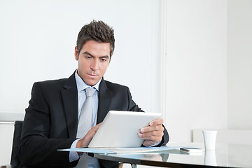 Image showing Young Businessman With Digital Tablet And Coffee Cup