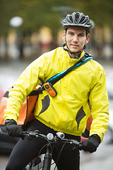 Image showing Young Male Cyclist With Courier Delivery Bag On Street