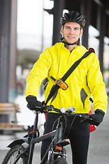 Image showing Young Man In Protective Gear With Bicycle