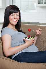 Image showing Pregnant Woman Eating Fruit Salad