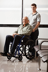 Image showing Man With Grandfather Sitting In Wheelchair