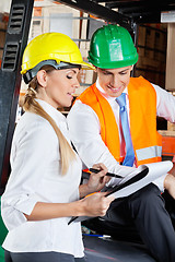 Image showing Supervisor Communicating With Colleague At Warehouse