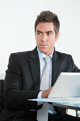 Image showing Young Businessman Using Digital Tablet In Office