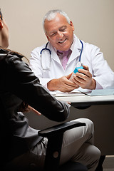 Image showing Doctor Holding Medicine Box