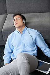 Image showing Man Listening Music On Digital Tablet