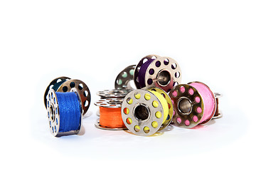 Image showing Pile of colorful thread spools