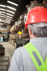 Image showing Foreman With Arms Crossed Standing At Warehouse