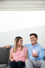 Image showing Couple With Piggybank