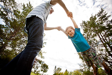 Image showing Father and Son Playing in Park