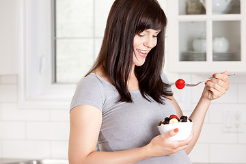 Image showing Pregnant Woman Eating Fresh Fruit