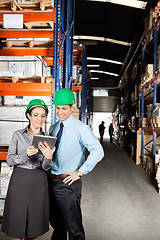 Image showing Supervisors Using Digital Tablet At Warehouse